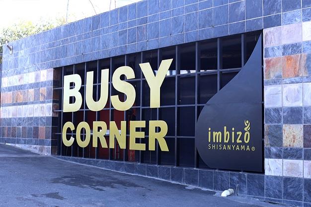 Busy Corner signage — Business